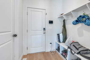 Mudroom featuring hardwood / wood-style floors