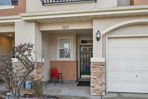 Entrance to property featuring a garage