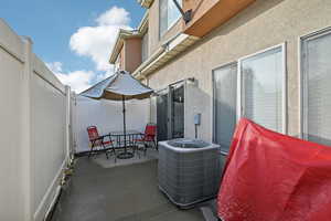 View of patio with central air condition unit