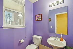 Bathroom featuring sink and toilet