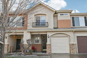 View of property with a garage