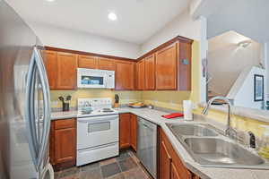 Kitchen with stainless steel appliances and sink