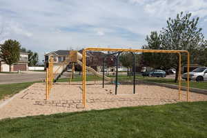 View of play area with a lawn