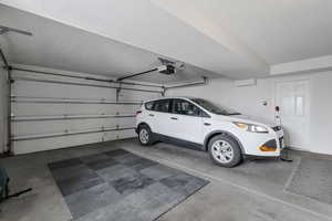 Garage featuring a garage door opener