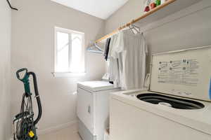 Laundry room with washing machine and clothes dryer