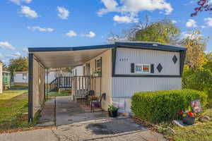 View of home's exterior featuring a carport