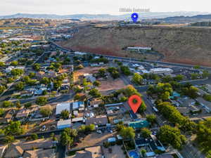 Birds eye view of property with a mountain view