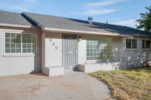 Entrance to property with a patio