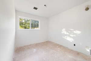 Spare room featuring a textured ceiling