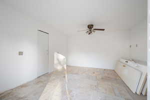 Spare room with ceiling fan