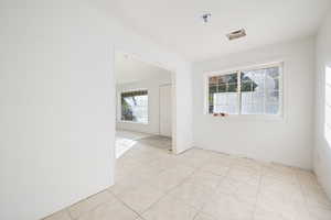 Spare room featuring light tile patterned flooring