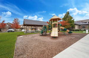 View of play area with a lawn