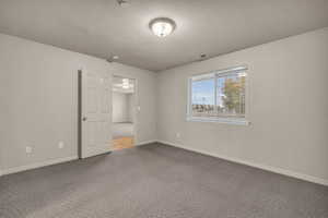 Interior space featuring a textured ceiling