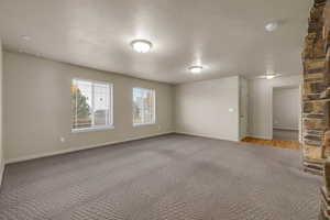 Spare room with carpet and a textured ceiling