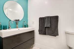 Upgraded bathroom with new paint, dual vanity, mirror, and lighting. Stay comfortable all winter with heated floors!