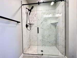 Bathroom with a shower with shower door