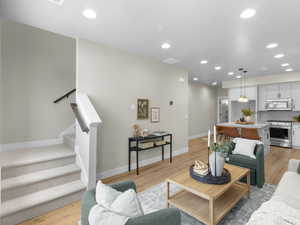 Living room with light hardwood / wood-style flooring