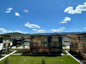 View of property with a mountain view