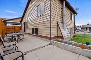 View of side of property with a patio area