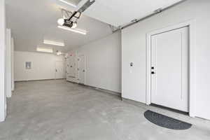 Garage with a garage door opener and electric panel