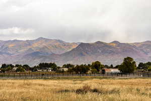 Property view of mountains featuring a rural view