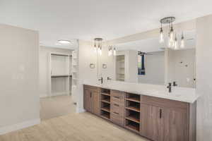 Bathroom featuring vanity and hardwood / wood-style flooring