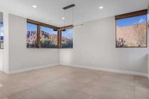 Tiled spare room with a mountain view