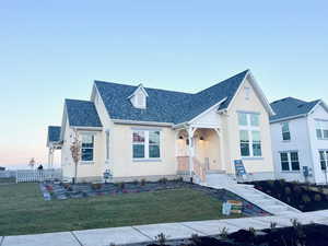 View of front of property featuring a yard