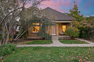 View of front of property with a lawn