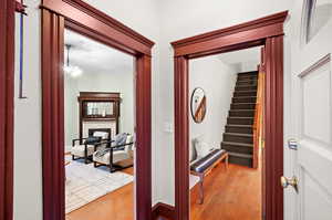 Corridor with light hardwood / wood-style flooring