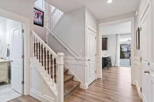 Stairs featuring wood-type flooring