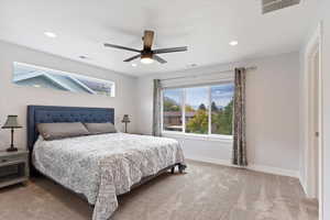 Primary Bedroom with ceiling fan and ensuite