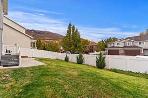 View of yard featuring a mountain view and a patio