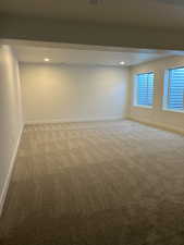 Empty room featuring carpet floors