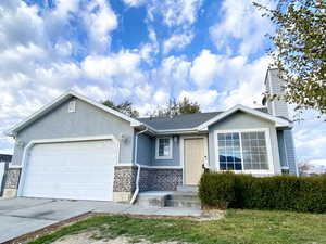 View of front of property featuring a garage