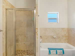 Bathroom featuring separate shower and tub