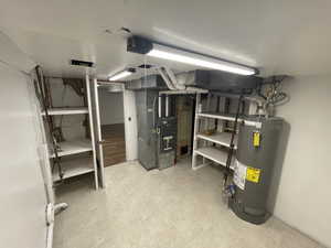 Utilities featuring heating unit and gas water heater