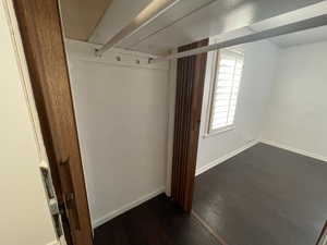 Mudroom with dark wood-type flooring