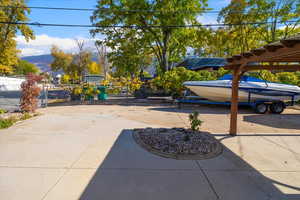 View of patio / terrace with a mountain view and a carport