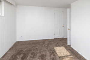 Bedroom with dark carpet