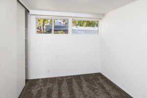 Bedroom featuring a healthy amount of sunlight and carpet