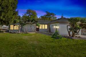 View of front of house featuring a lawn