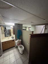 Basement Bathroom with shower and laundry area