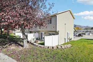 Exterior space featuring a lawn and a mountain view