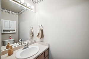 Bathroom with toilet and vanity