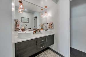 Bathroom featuring vanity and tile patterned floors