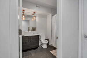 Bathroom with vanity and toilet