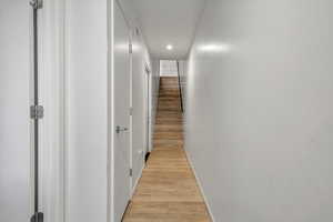 Corridor featuring light hardwood / wood-style flooring