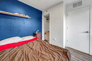 Bedroom featuring a closet and hardwood / wood-style floors