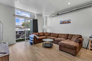 Living room with light wood-type flooring